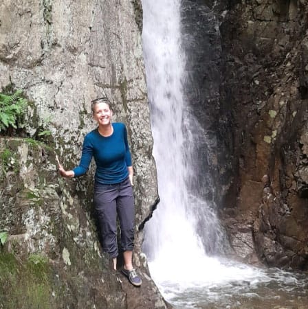 Rebecca Bruhn NHOLC instructor NHOLC instructor Rebecca Bruhn standing by a waterfall