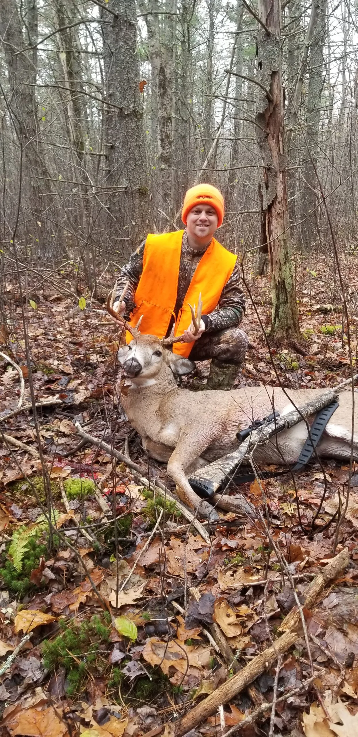 Brad with trophy buck Hunter with a trophy whitetail deer