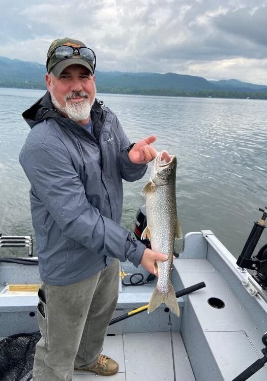 Craig Poirier NHOLC instructor NHOLC instructor, Craig Poirier, with a big lake trout.